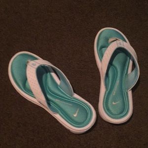 Blue and white Nike comfort flip flops